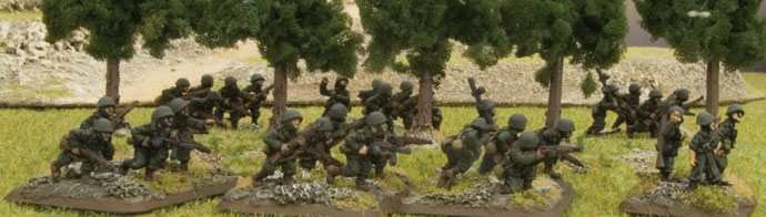 Italian infantry move through a forrest