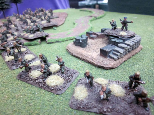 A Strelkovy company seizes an objective under the watchful eye of their Komissar