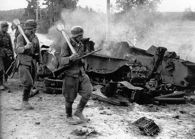 Finnish Troop March Past a wreaked T-34