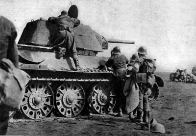 Romanian Infantry check out a T-34