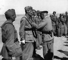 Ramcke giving medels to Italian troops