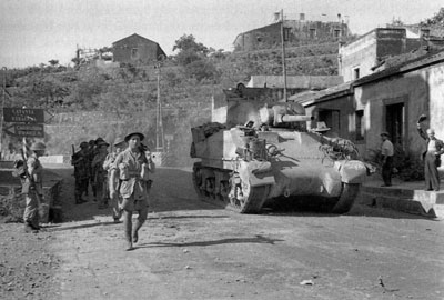 British armour advances down an Italian road