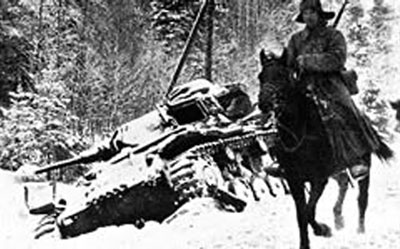 Soviet cavalryman pases an abandoned Panzer III