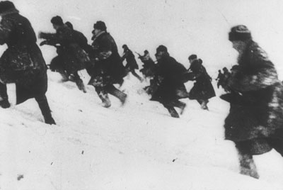 Soviet riflemen advance through the snow