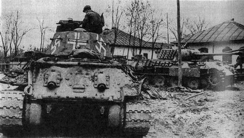 T-34 mod 1942/43 using a German Cross on the rear panel of the turret & Swastikas on the sides (Rear sections) of the turret of the tank.