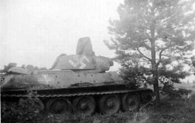 T-34 mod 1941/42 with some writing on the side (Front section) of the turret & on the side (Rear section) of the tank. (In the middle of the German Cross).