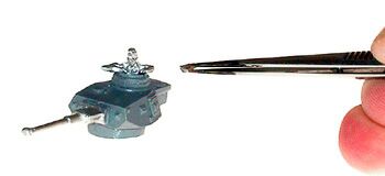 Attaching small parts with tweezers