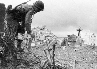 2nd Division engineer marks a mine cleared road