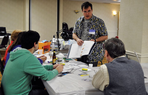 Don Goddard leads his class through the basics of sculpting