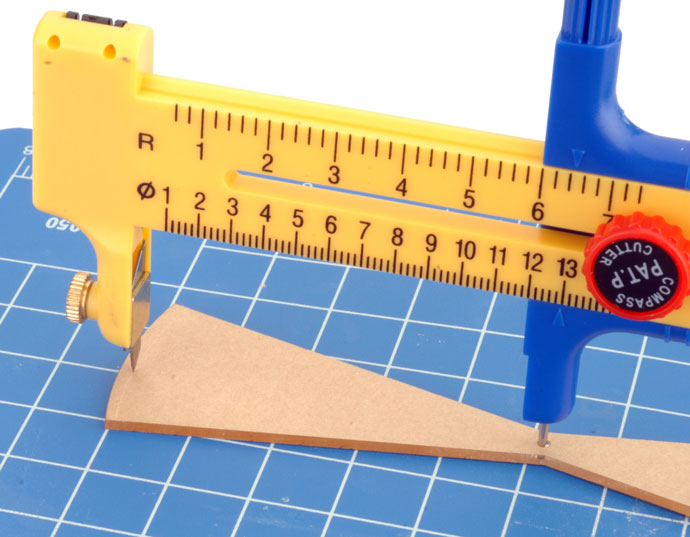 Using the Compass Cutter to cut the mask. Using the Compass Cutter to cut the mask.