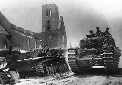 A Churchill IV passes a bombed out church