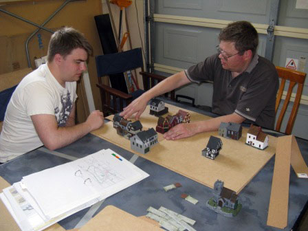 Richard and Guy laying out a town.
