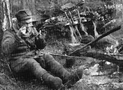 A Finnish infantryman takes a meal break
