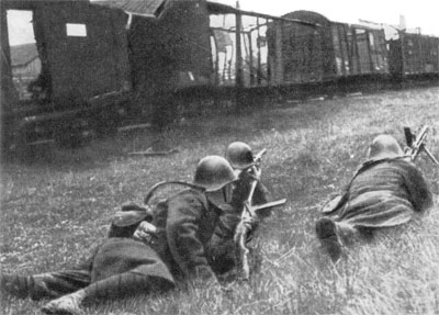 Romanian Infantry take cover behind a destroyed train