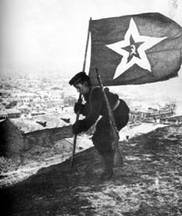 A Soviet Sailor plants the flag at Kerch