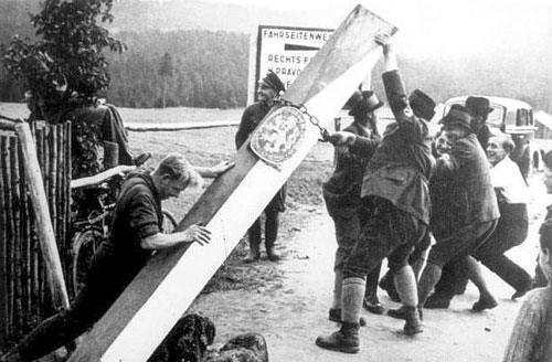 Sudeten Germans knock down the Czech border post separating it from Germany