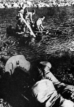 Soviet crossing a river under covering fire