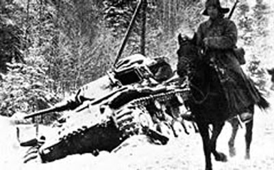 Soviet cavalryman pases an abandoned Panzer III