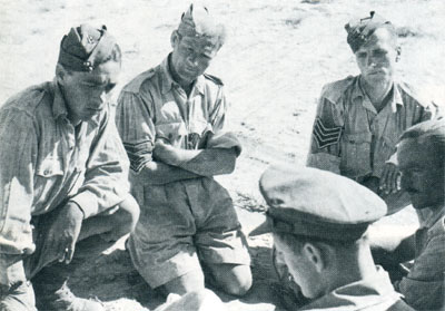Charles Calistan (left) and fellow NCOs