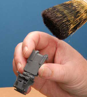 Remove the resin dust with a large brush