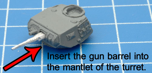 Inserting the gun barrel into the turret
