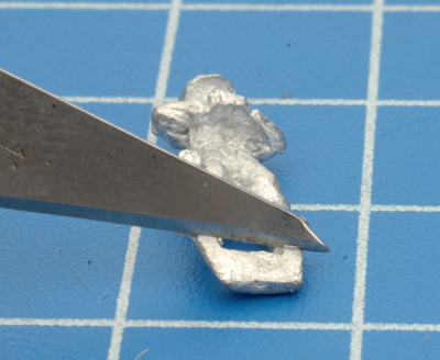 Removing the tab from the Gunner figure