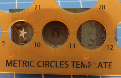 Using a stencil to measure to width of the turret recess