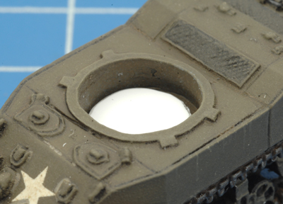 Place the plastic disc into the bottom of turret recess