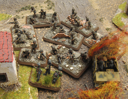 The Nisei Rifle Platoon swarm the German position who offer little resistance