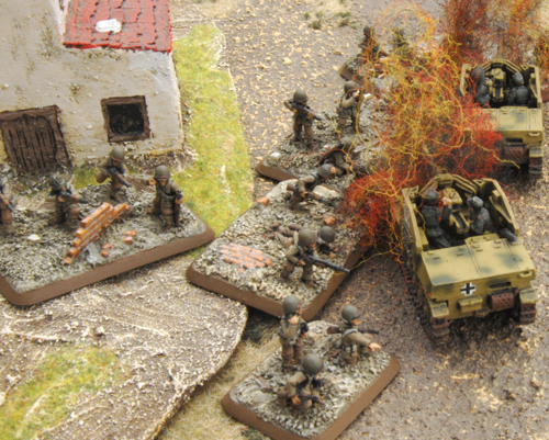 The Rifle platoon catch their breath as they consolidate behind the burning wrecks of the Marder II platoon