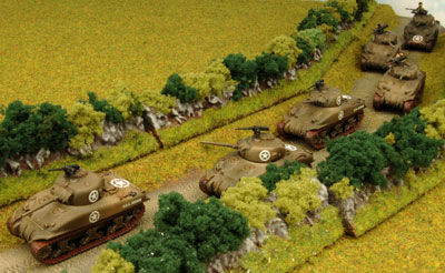 The American tanks move up the road The American tanks move up the road