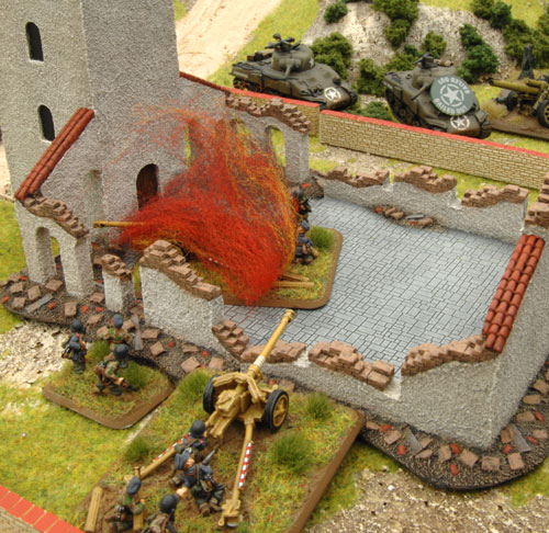 A PaK40 bails out a Sherman