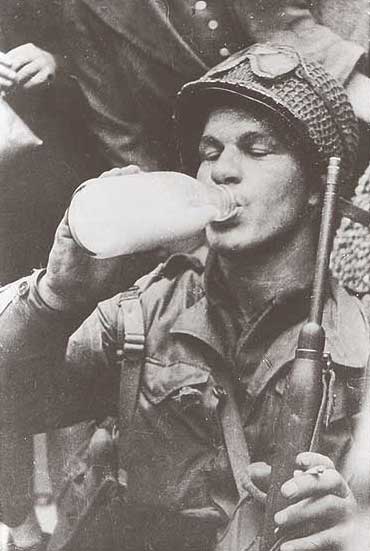 US Paratrooper enjoys the milk of England before flying off into danger