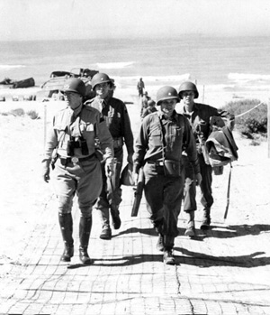 Patton (left) arrives at Gela, note the Summerville Matting underfoot