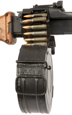 A close-up view of the drum magazine and the feed system on the RPD