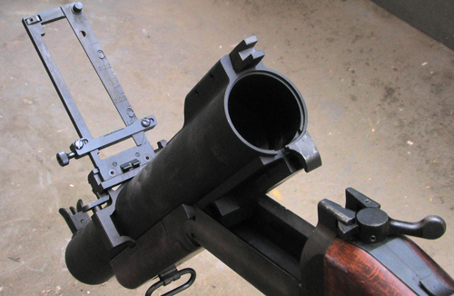 A close-up view to the M79 ready for loading and the flip-up sight